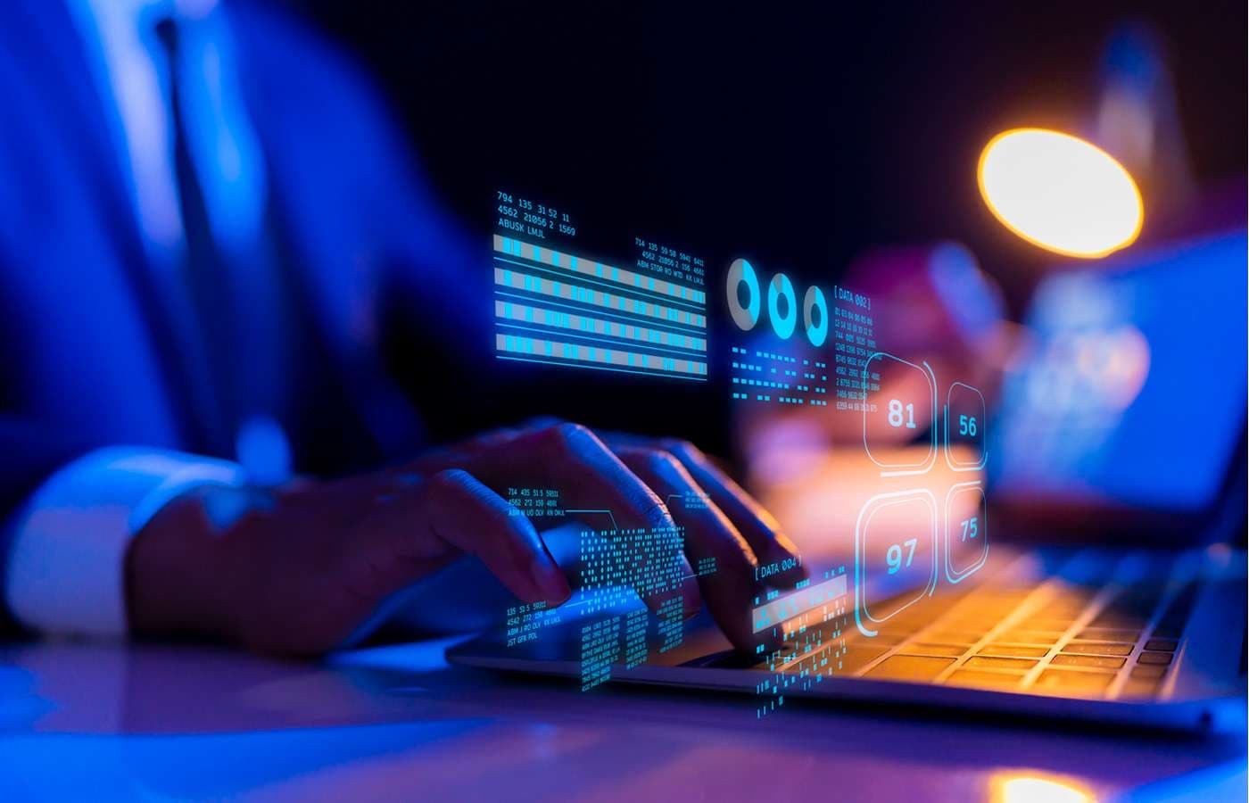 Hands on a backlit keyboard under floating dashboards